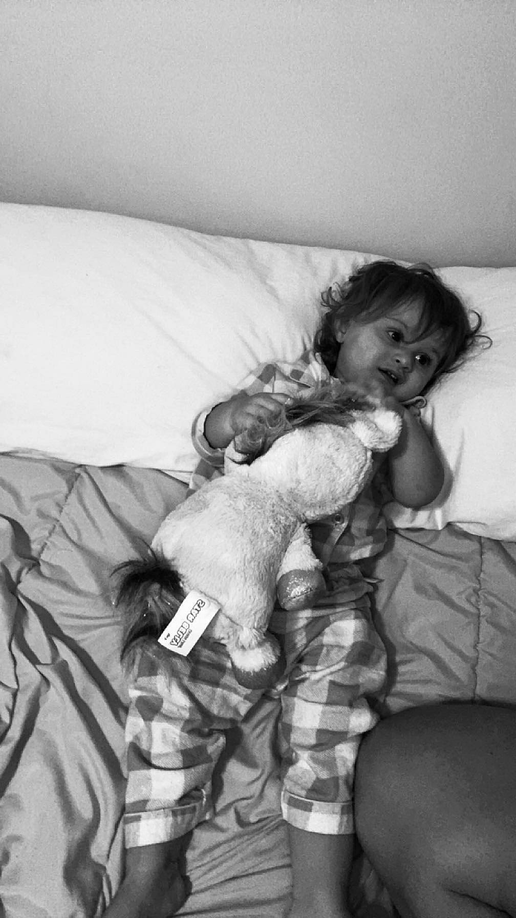 Elijah joined the competition — help win amazing prizes! baby, bed, bedding, child, comfort, elbow, fun, gesture, happy, human_leg, linens, monochrome, monochrome_photography, person, pillow, room, smile, textile, thigh, thumb