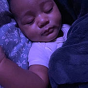Pharaoh is registered to the contest to win money with this photo: arm, baby, blanket, child, closeup, clothing, comfort, cute, face, indoors, infant, peace, peaceful, pillow, portrait, purple_light, rest, sleeping, soft, toddler