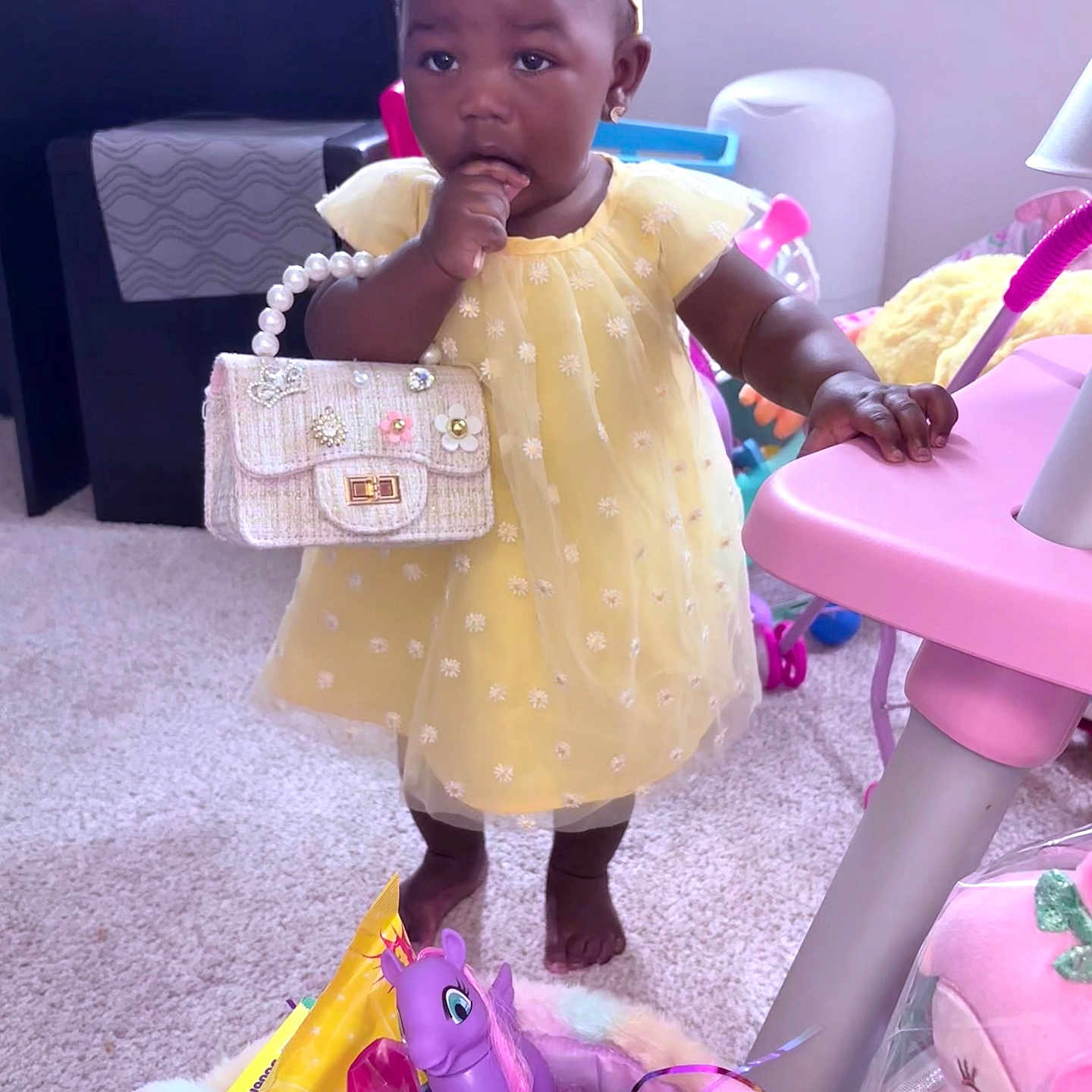 Aziya is registered to the contest to win money with this photo: accessories, baby, bag, clothing, couch, dress, face, furniture, handbag, happy, hat, head, homedecor, jewelry, necklace, person, photography, portrait, purple, sitting