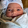 Arabella is registered to the contest to win money with this photo: newborn, baby, infant, wrapped, blanket, hat, bow, face, eyes, indoor, portrait, cute, soft, warm, cozy, child, person, headwear, newborn_hat, expression