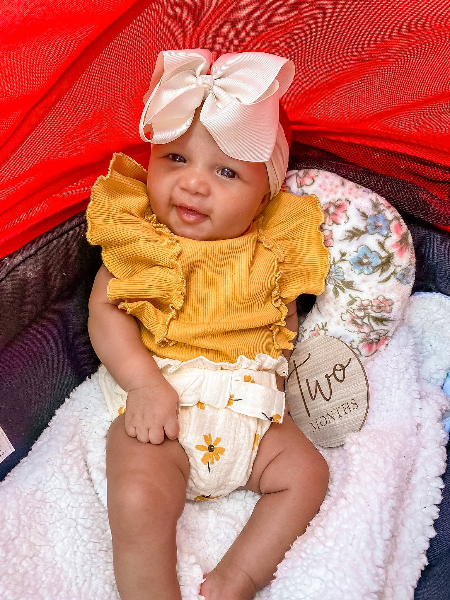 Laylani joined the competition — help win amazing prizes! baby, baby_toddler_clothing, cap, chair, child, clothing, comfort, eye, fashion_accessory, fun, happy, head, headwear, lap, linens, person, pink, sitting, skin, smile