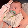 Enzo joined the competition — help win amazing prizes! baby, pacifier, infant, person, hand, blanket, towel, clothing, arm, skin, newborn, comfort, resting, cute, holding, indoors, soft, white, pink, green