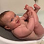 baby, bath, water, smile, child, skin, hand, foot, happy, indoors, cute, toddler, head, face, playful, naked, sitting, person, bathroom, skin_tone