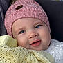 baby, child, face, hat, knit_hat, blue_eyes, blanket, yellow_blanket, smile, cute, portrait, close_up, warm_clothing, cozy, soft_texture, infant, young_child, happy, indoor, headwear