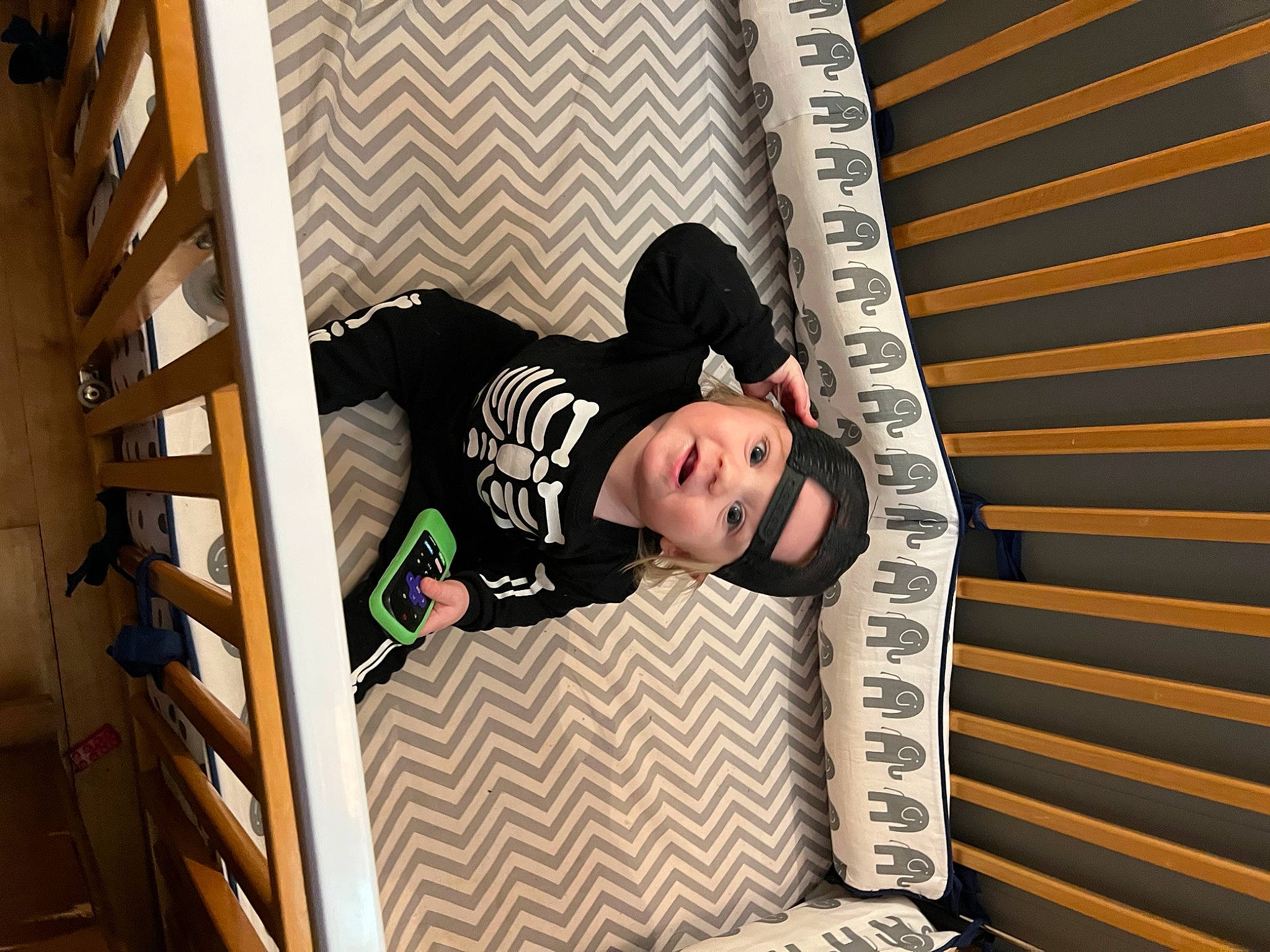 Logan joined the competition — help win amazing prizes! bed, child, comfort, flash_photography, flooring, happy, hardwood, headwear, leisure, linens, pattern, person, portrait_photography, room, sitting, stairs, sunglasses, t_shirt, wood