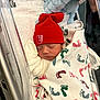 newborn, baby, sleeping, blanket, hospital, bassinet, red_hat, footprint_pattern, stuffed_animal, soft_toy, wrapped, infant, cute, cozy, child, sleep, clothing, bed, rest, newborn_baby