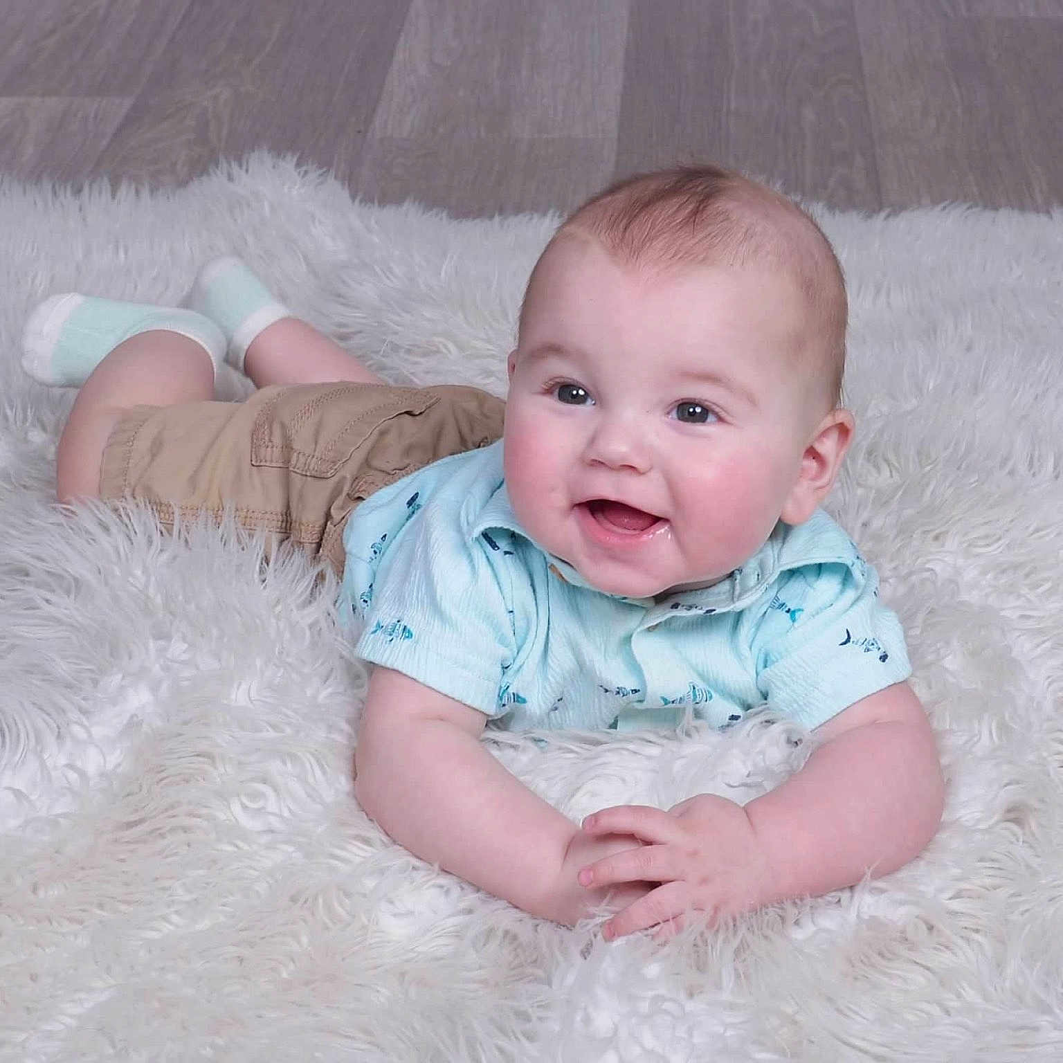 Dawson is registered to the contest to win money with this photo: baby, babylaughing, crawling, face, happy, head, laughing, newborn, person, photography, portrait, sitting, smile