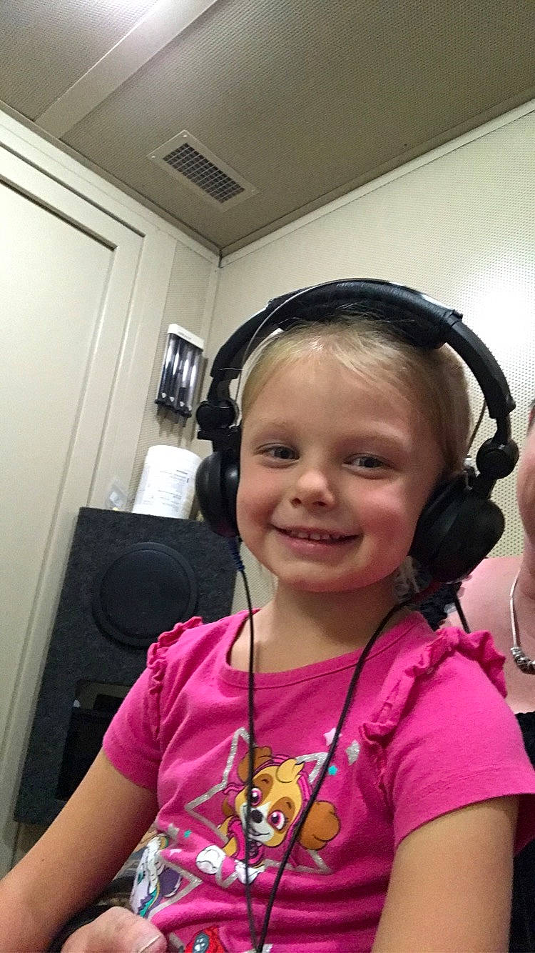 Aubrie joined the competition — help win amazing prizes! audio_equipment, black_hair, cheek, child, communication_device, ear, electronic_device, gadget, head, headphones, hearing, joy, person, pigtail, selfie, skin, smile, technology, toddler