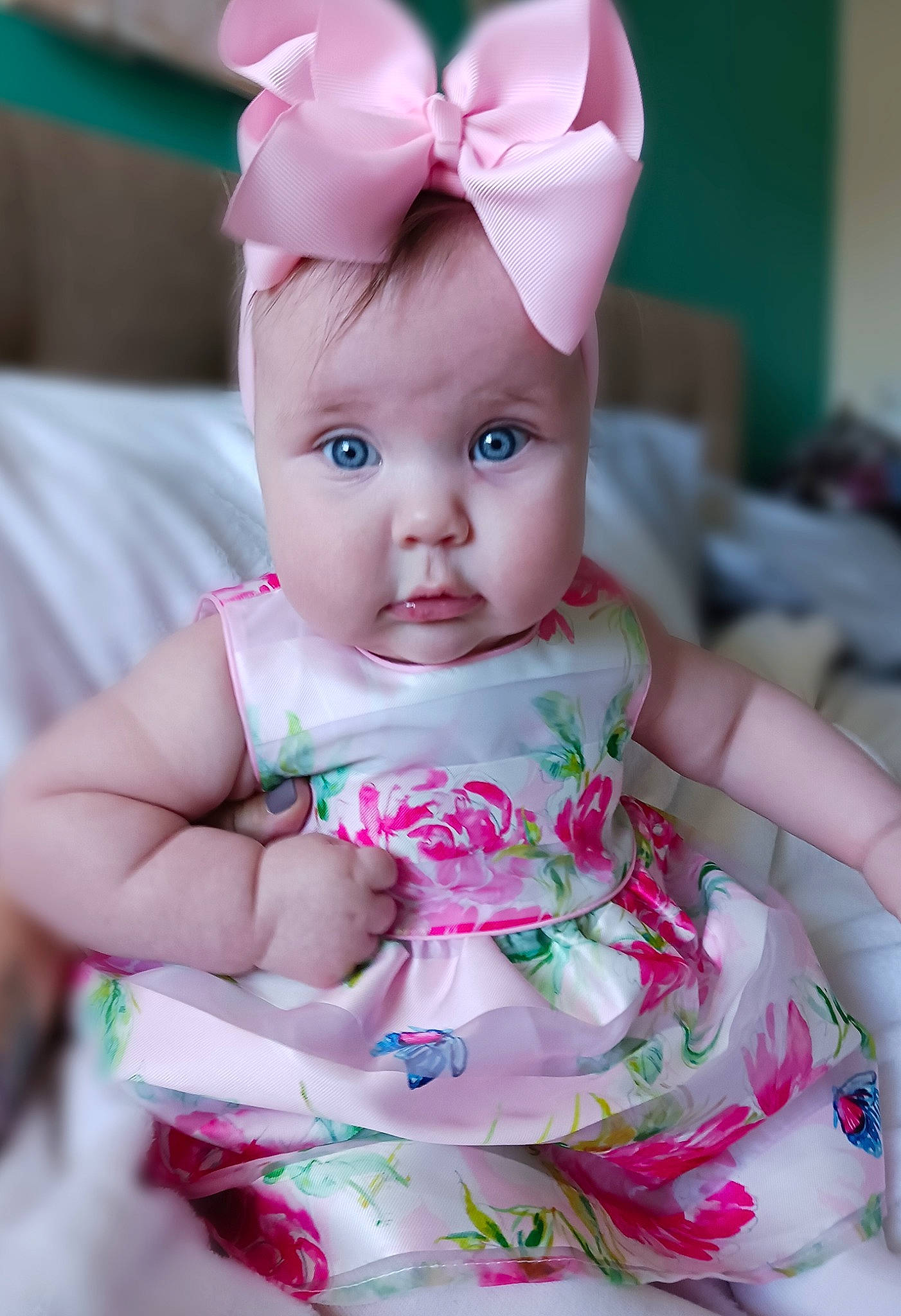 Aubrie is registered to the contest to win money with this photo: baby, baby_toddler_clothing, cap, cheek, child, dress, eye, fashion_accessory, finger, happy, head, headwear, lip, magenta, pattern, person, pink, skin, sleeve, sweetness