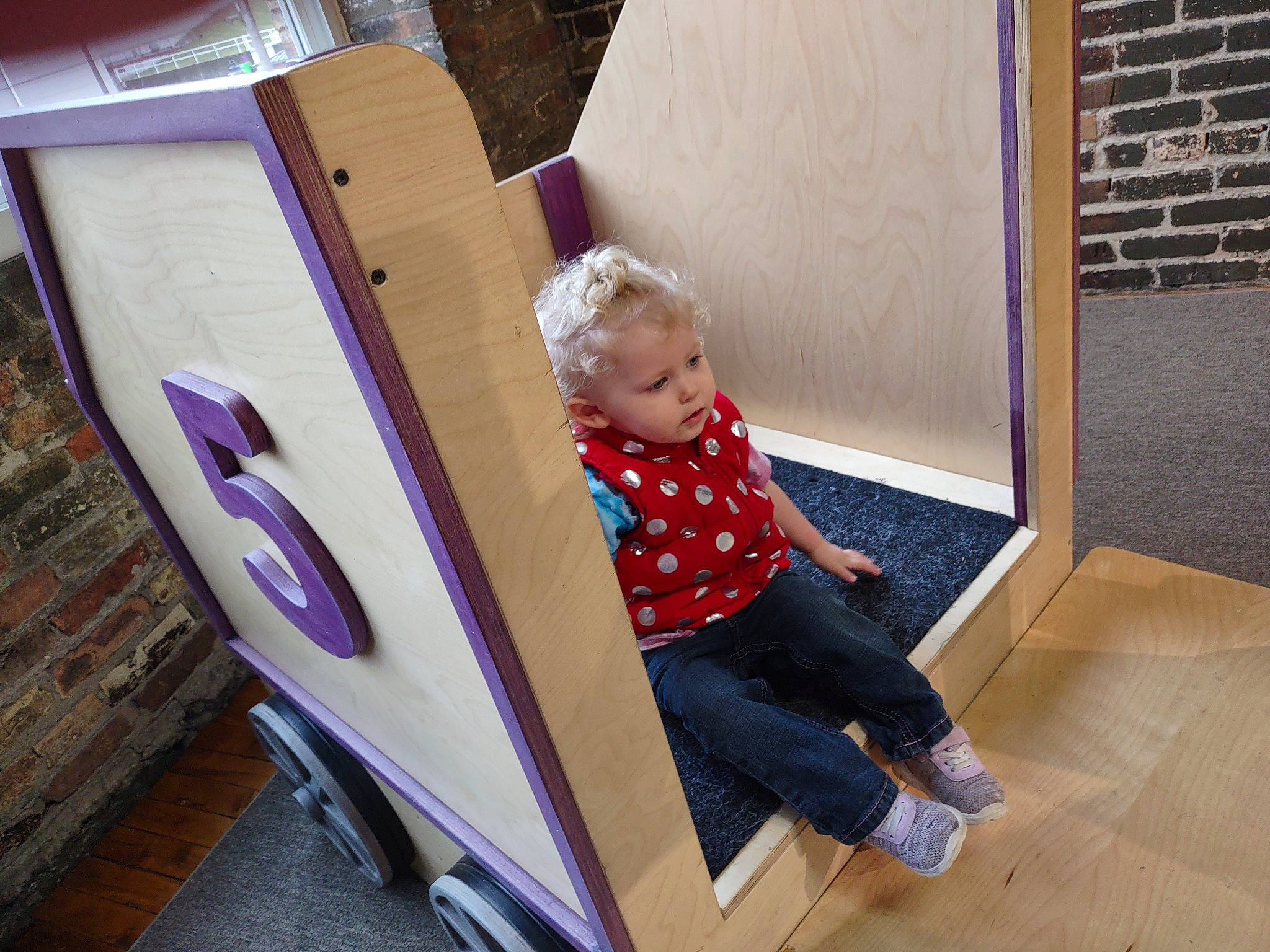 Journey is registered to the contest to win money with this photo: baby, baby_toddler_clothing, child, comfort, drawer, floor, flooring, fun, hardwood, laptop, leisure, person, room, sitting, t_shirt, toddler, wood, wood_flooring