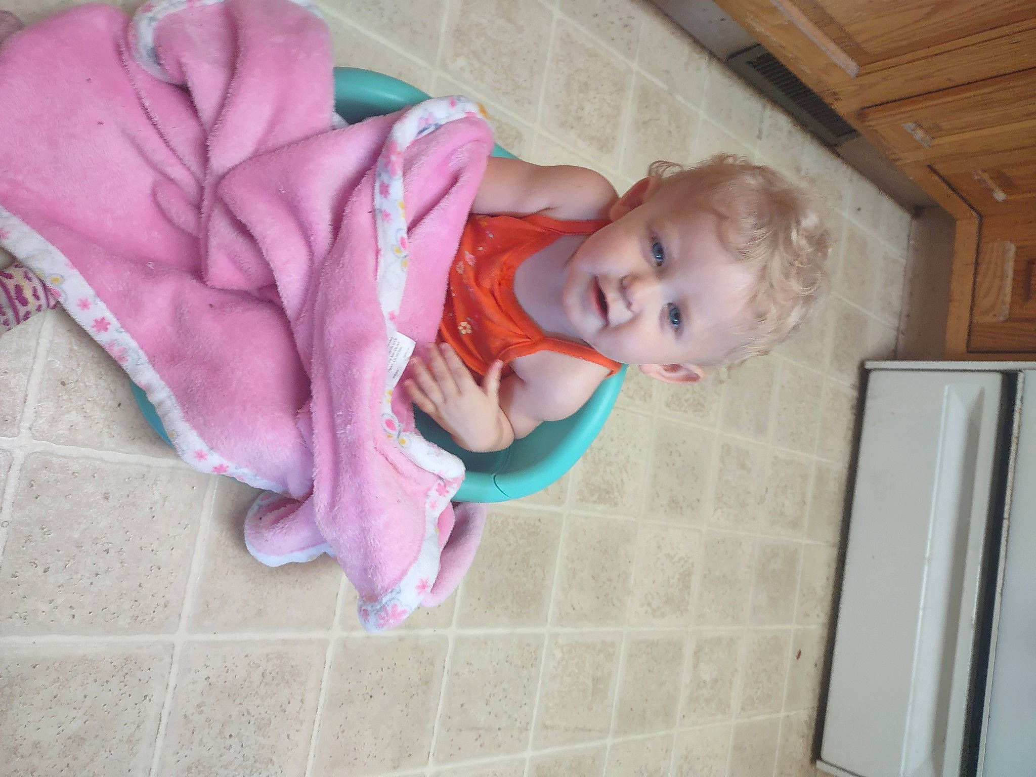 Journey is registered to the contest to win money with this photo: baby, baby_products, baby_safety, baby_toddler_clothing, cheek, child, comfort, floor, flooring, fun, hardwood, linens, magenta, person, pink, room, sitting, sock, toddler, wood