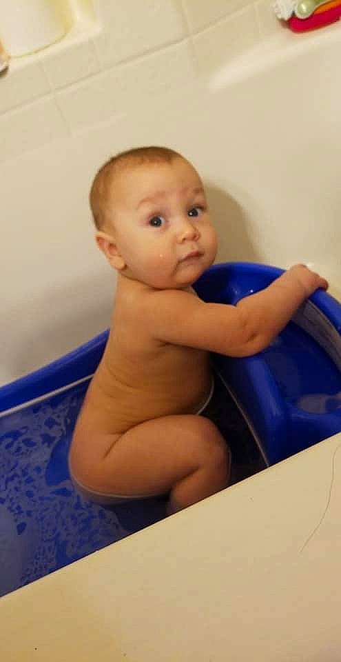 Haidyn is registered to the contest to win money with this photo: arm, bathing, cheek, child, finger, hand, infant, leg, mouth, person, play, product, skin, surprise, toddler