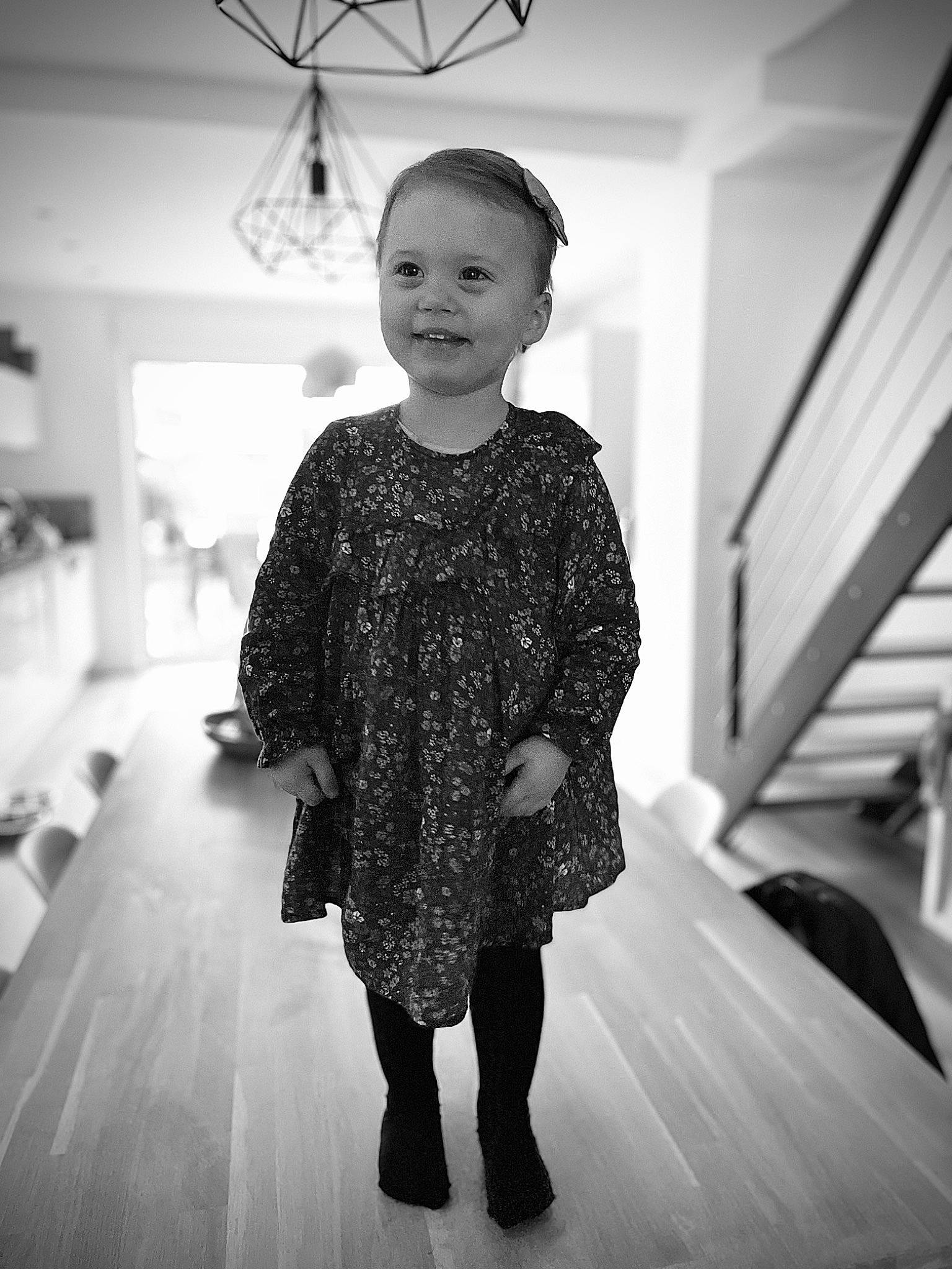 Agathe participe au concours pour gagner de l'argent avec cette photo : baby_toddler_clothing, black, black_and_white, child_model, day_dress, design, embellishment, flash_photography, floor, flooring, iris, joy, lighting_accessory, monochrome, monochrome_photography, one_piece_garment, pattern, person, standing, style