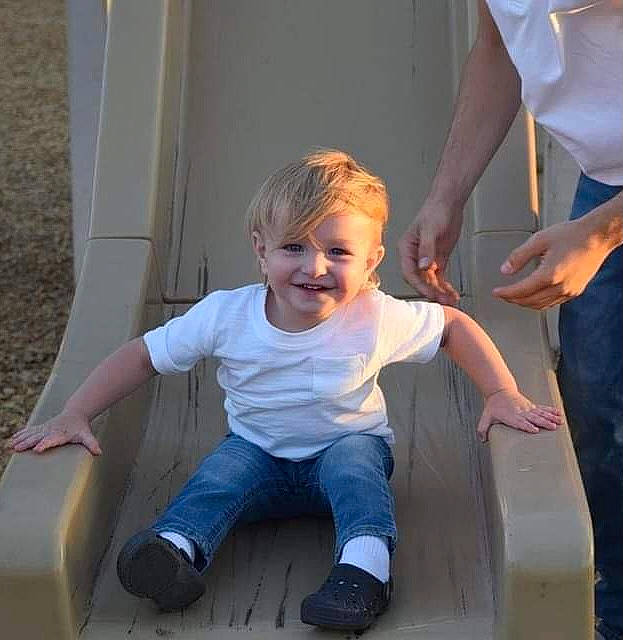 Brayden is registered to the contest to win money with this photo: baby_toddler_clothing, child, electric_blue, finger, fun, gesture, hairstyle, hand, happy, holding_hands, joint, joy, leg, leisure, person, shoulder, sitting, sleeve, smile, standing