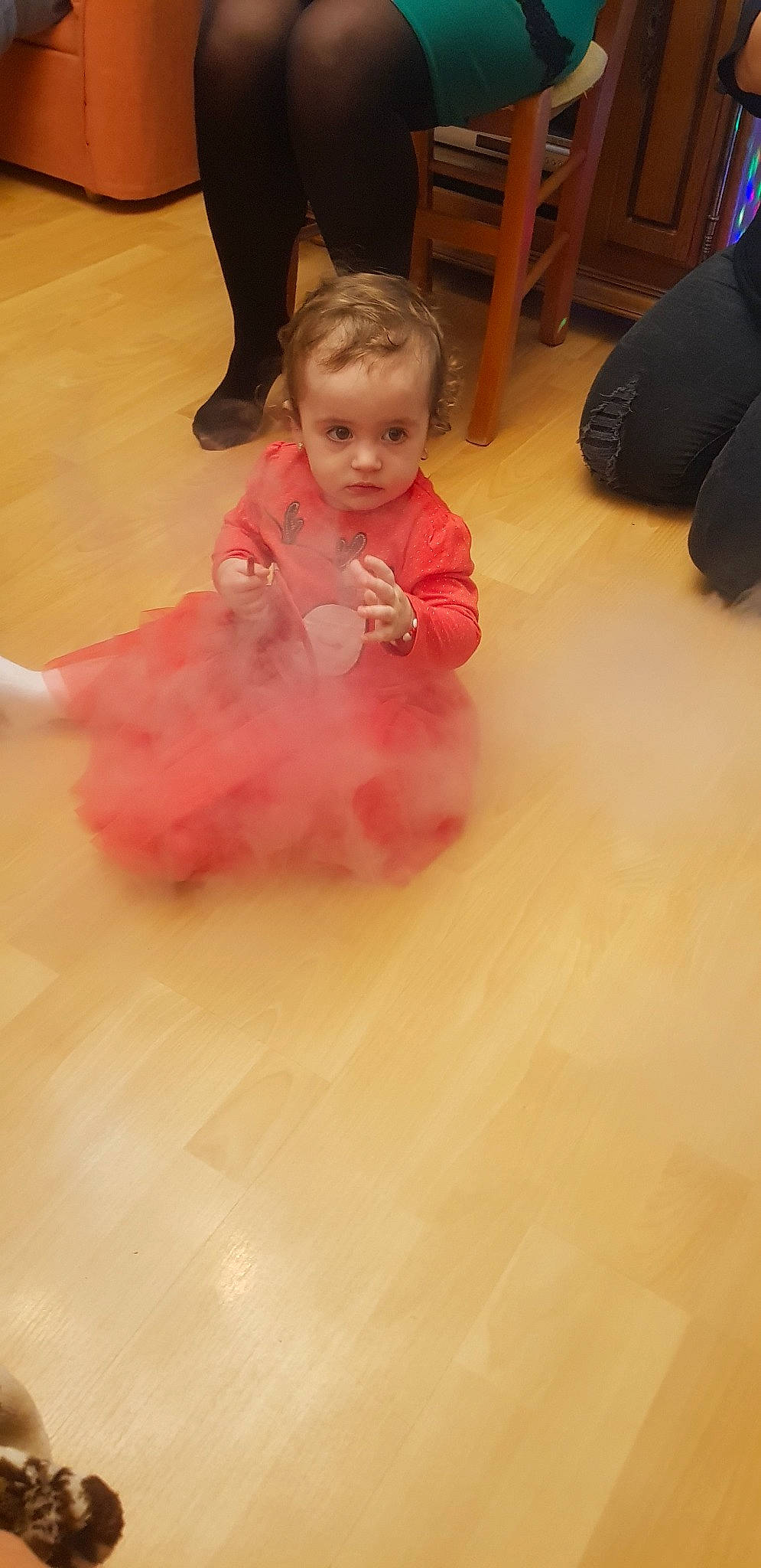 Maya is registered to the contest to win money with this photo: baby, child, costume, floor, flooring, hardwood, person, pink, play, toddler, wood