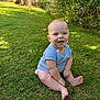 baby, child, grass, outdoor, smiling, blue_clothing, sitting, greenery, nature, sunlight, trees, bushes, happy, cute, infant, skin, barefoot, daylight, young_child, portrait