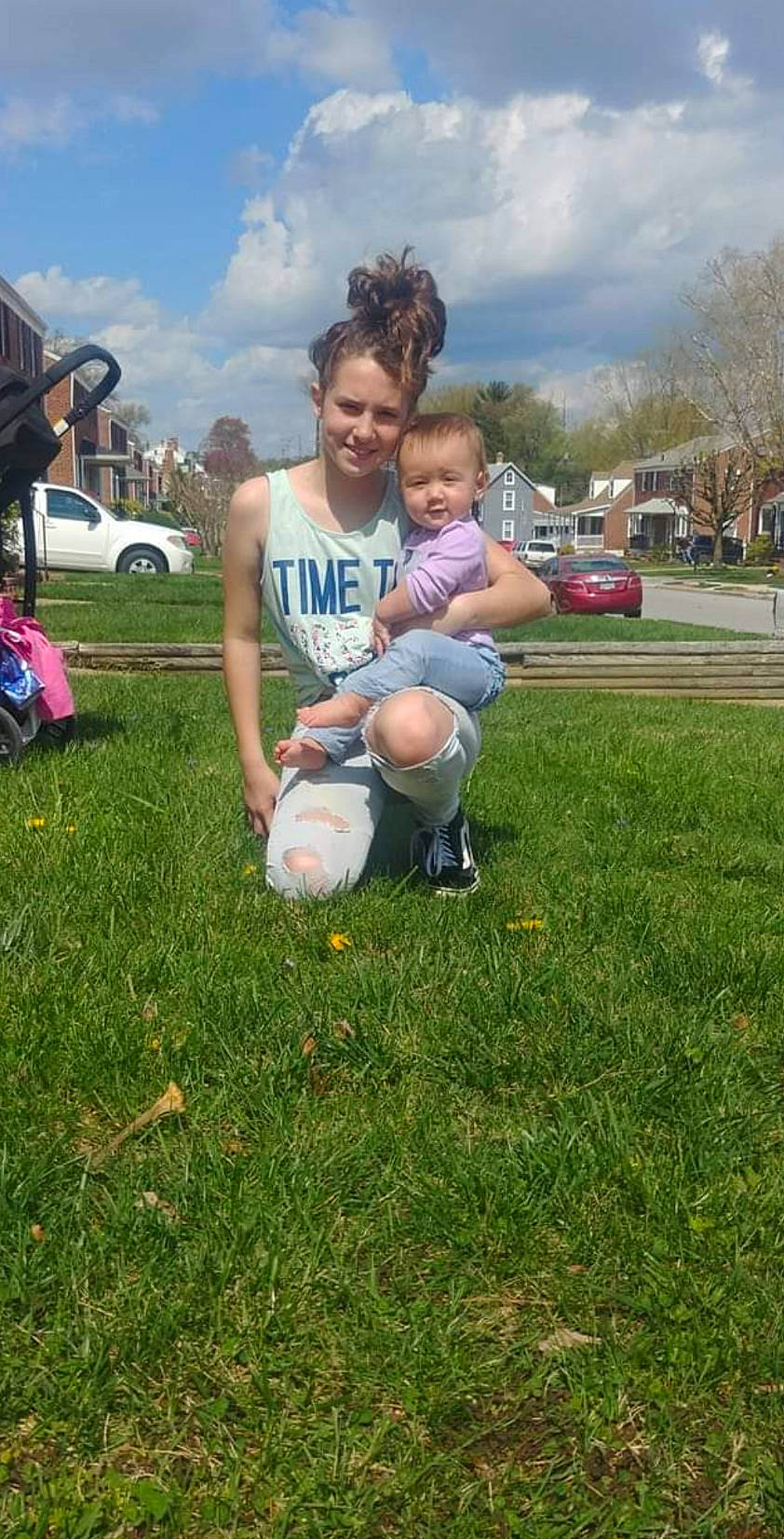 Emma is registered to the contest to win money with this photo: ball, cloud, football, fun, grass, grass_family, grassland, happy, joy, lawn, leisure, people_in_nature, person, recreation, shorts, sky, sneakers, sports_equipment, t_shirt, tire