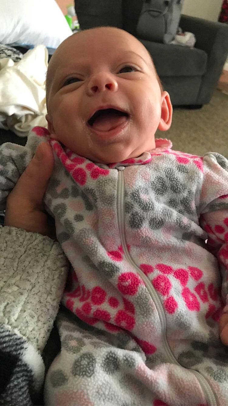 Amora is registered to the contest to win money with this photo: baby, baby_laughing, baby_toddler_clothing, cheek, chin, comfort, dress, eye, face, happy, head, iris, lip, nose, person, pink, skin, sleeve, smile, toddler