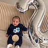 Pablo a rejoint le concours — aidez-le/la à gagner de superbes lots ! baby, infant, smile, balloon, number_2, celebration, blanket, couch, clothing, socks, indoor, portrait, child, happy, cute, person, home, soft, texture, milestone