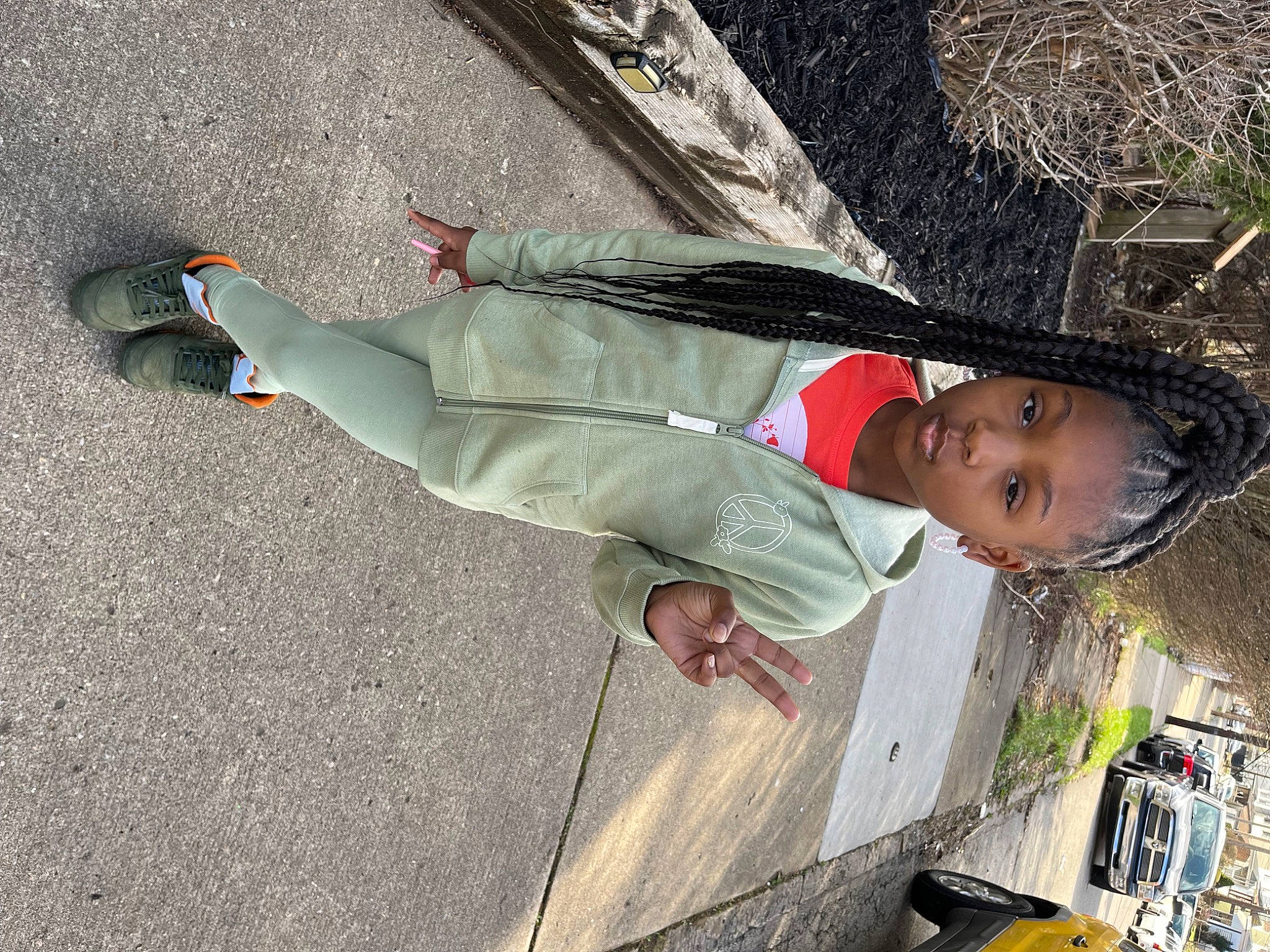 Desire is registered to the contest to win money with this photo: concrete, fun, hat, human_leg, leisure, outdoor_shoe, pedestrian, person, recreation, road_surface, shadow, toddler, tree, walking_shoe