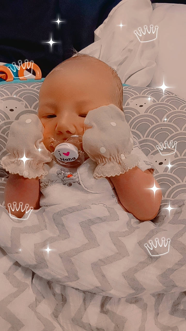 Elijah is registered to the contest to win money with this photo: baby, baby_products, baby_sleeping, baby_toddler_clothing, baby_toys, cheek, child, comfort, event, fashion_accessory, light, lighting, linens, peach, person, pink, room, skin, toddler, toy