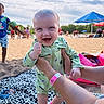 baby, beach, blanket, child, clouds, family, fun, hand, happy, onesie, outdoor, person, playing, sand, sky, smile, summer, sunny, umbrella, vacation