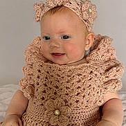 Ivy-Rose is registered to the contest to win money with this photo: baby, crochet, headband, smiling, infant, dress, handmade, cute, portrait, child, soft_light, indoors, happy, fashion, accessory, closeup, skin, face, young, sitting