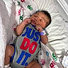 Micha joined the competition — help win amazing prizes! newborn, baby, infant, sleeping, blanket, hospital, onesie, clothing, wristband, bed, bassinet, cute, peaceful, resting, child, person, indoors, soft, colorful, sleep