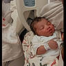 Micha joined the competition — help win amazing prizes! newborn, baby, sleeping, hospital, blanket, infant, parent, hospital_bed, hospital_wristband, medical, resting, peaceful, indoor, person, bed, control_panel, soft_lighting, closeup, portrait, care