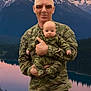 adult, baby, camouflage, child, clothing, forest, holding, infant, lake, landscape, man, military_uniform, mountain, nature, outdoor, person, portrait, scenery, sky, sunset