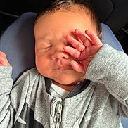 Zakaius is registered to the contest to win money with this photo: baby, infant, sleeping, hand, face, clothing, zipper, gray, cozy, resting, cute, skin, hair, person, child, newborn, toddler, soft, comfort, closeup