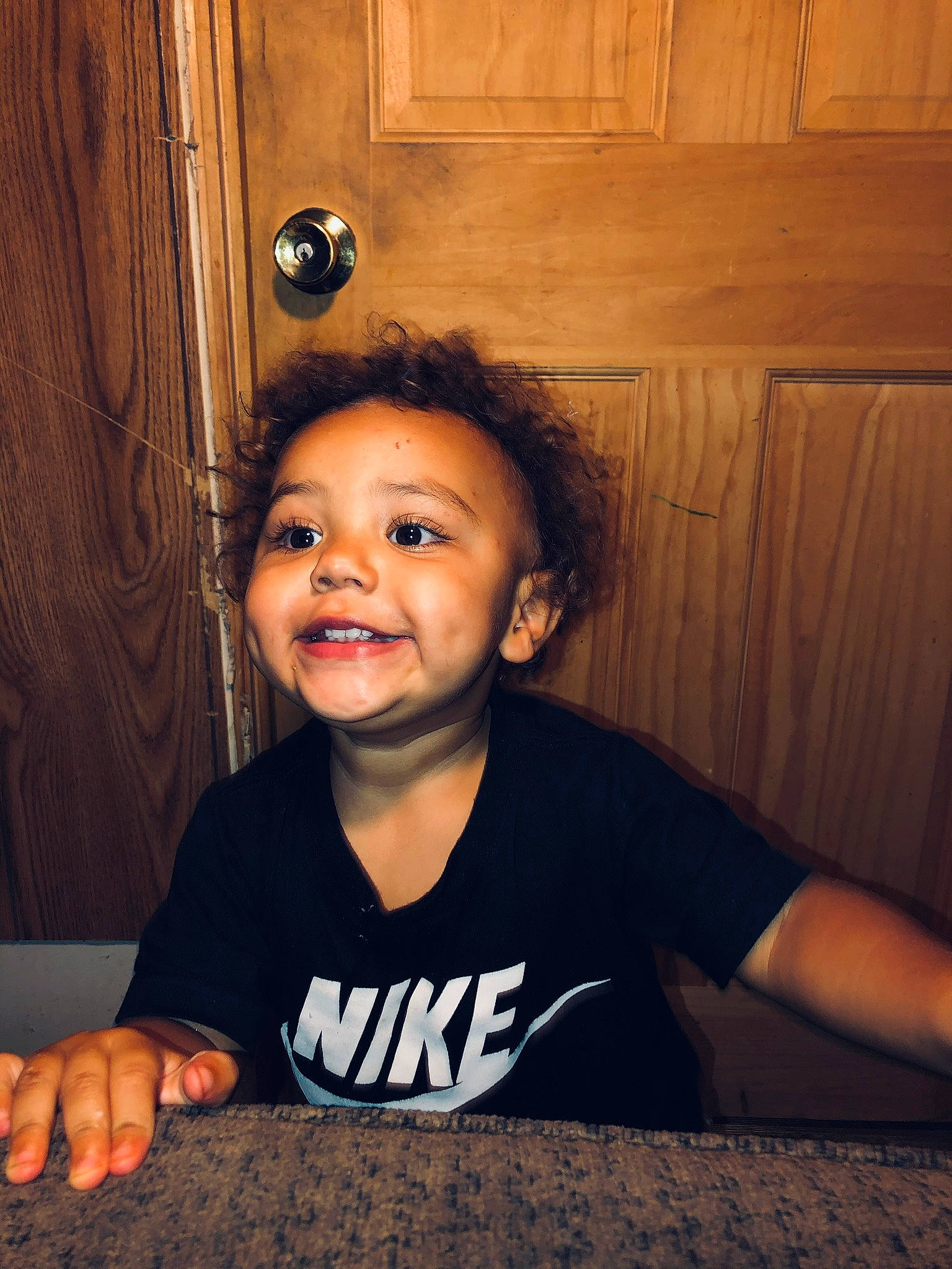 Zaiden is registered to the contest to win money with this photo: active_shirt, cabinetry, child_model, eye, eyelash, finger, mouth, nail, nose, person, portrait_photography, t_shirt, thumb, top, varnish, wood_stain