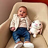 Jannah participe au concours pour gagner de l'argent avec cette photo : armchair, baby, beige, bunny, child, clothing, cozy, cute, furniture, happy, indoor, infant, jeans, pink, plush_toy, portrait, red_wall, shoes, smiling, soft_toy