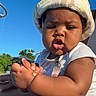baby, child, toddler, hat, bucket_hat, outdoor, blue_sky, sunlight, skin, expression, clothing, sitting, hands, face, cute, summer, nature, person, daylight, casual