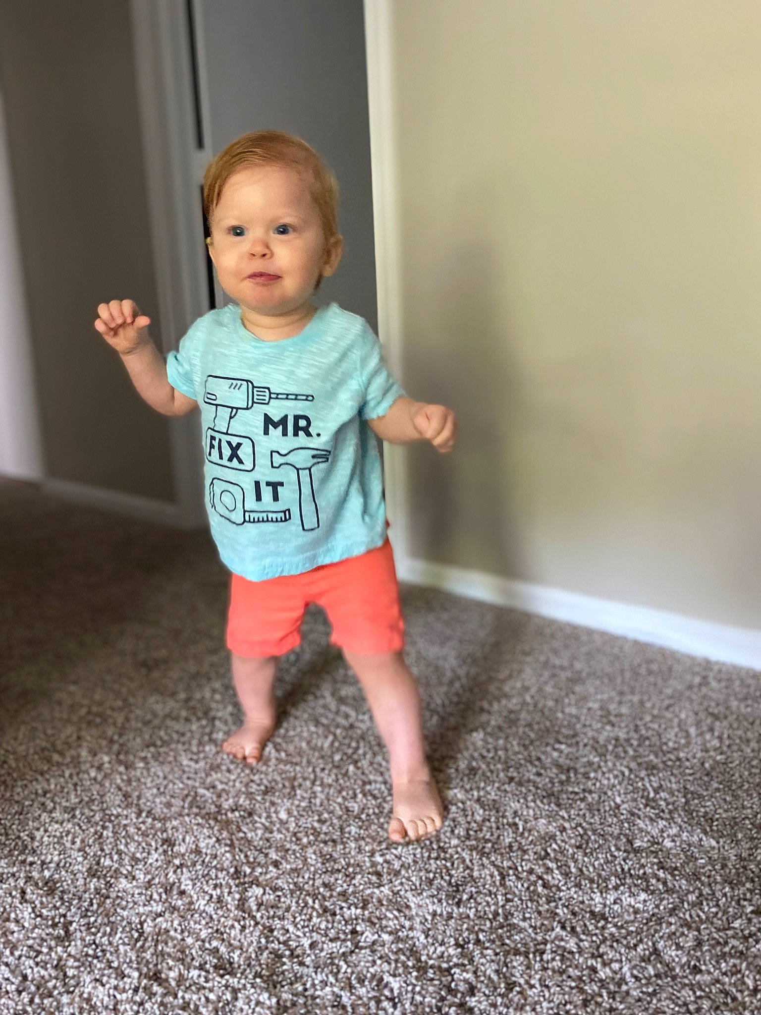 Beau is registered to the contest to win money with this photo: baby, baby_toddler_clothing, barefoot, child, elbow, face, flash_photography, flooring, foot, fun, happy, hardwood, human_leg, knee, leg, person, sitting, sleeve, t_shirt, toddler