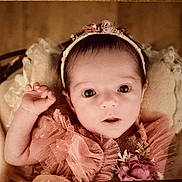 Charlyne participe au concours pour gagner de l'argent avec cette photo : baby, infant, face, headband, pink_clothing, blanket, soft_texture, portrait, cute, newborn, hand, flower, frilly, tulle, lying_down, closeup, child, adorable, baby_girl, curious