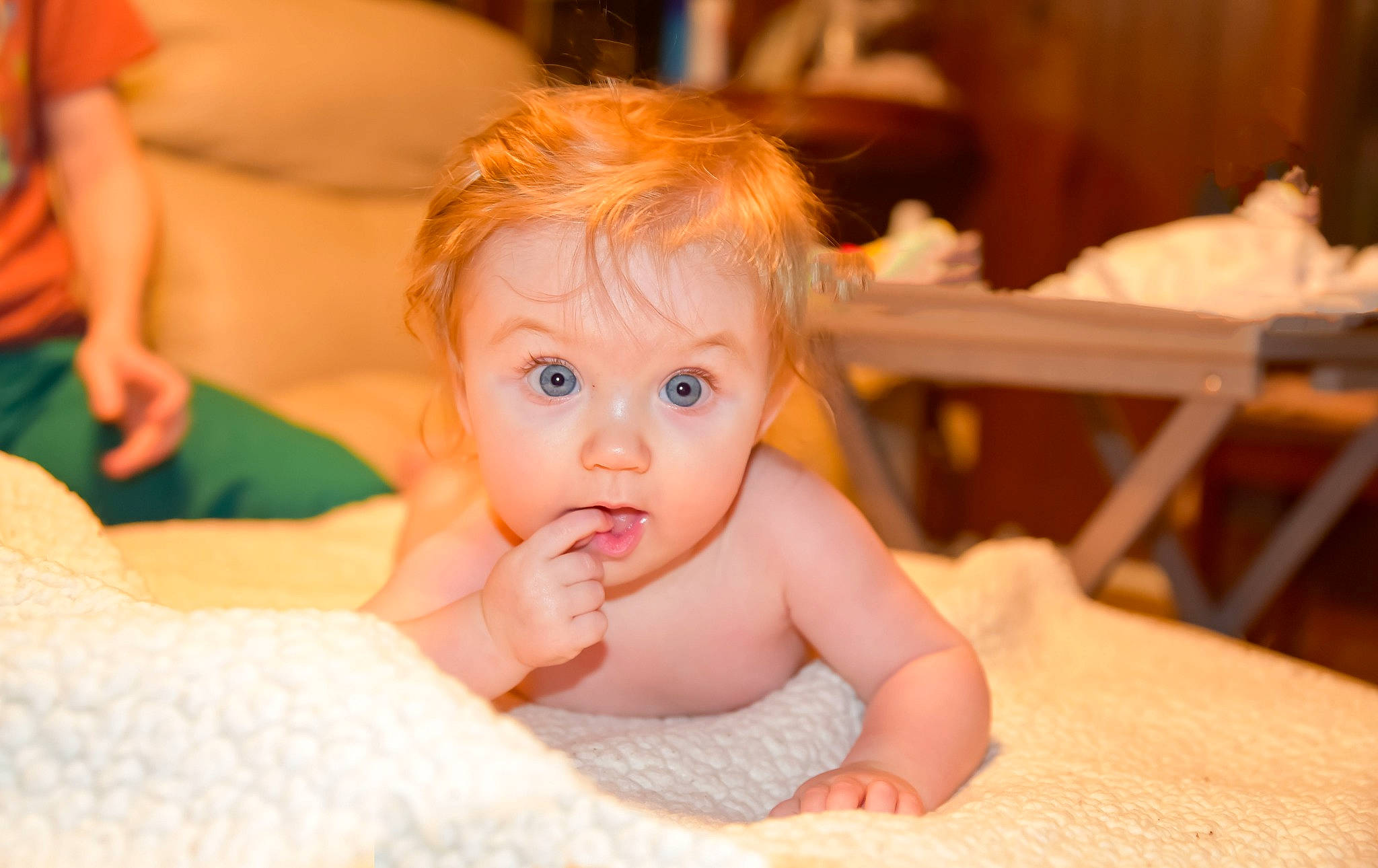 Tinzlee is registered to the contest to win money with this photo: baby, baby_toddler_clothing, chair, cheek, child, comfort, event, flooring, fun, gesture, happy, leisure, linens, person, room, sitting, smile, surprise, table, thumb