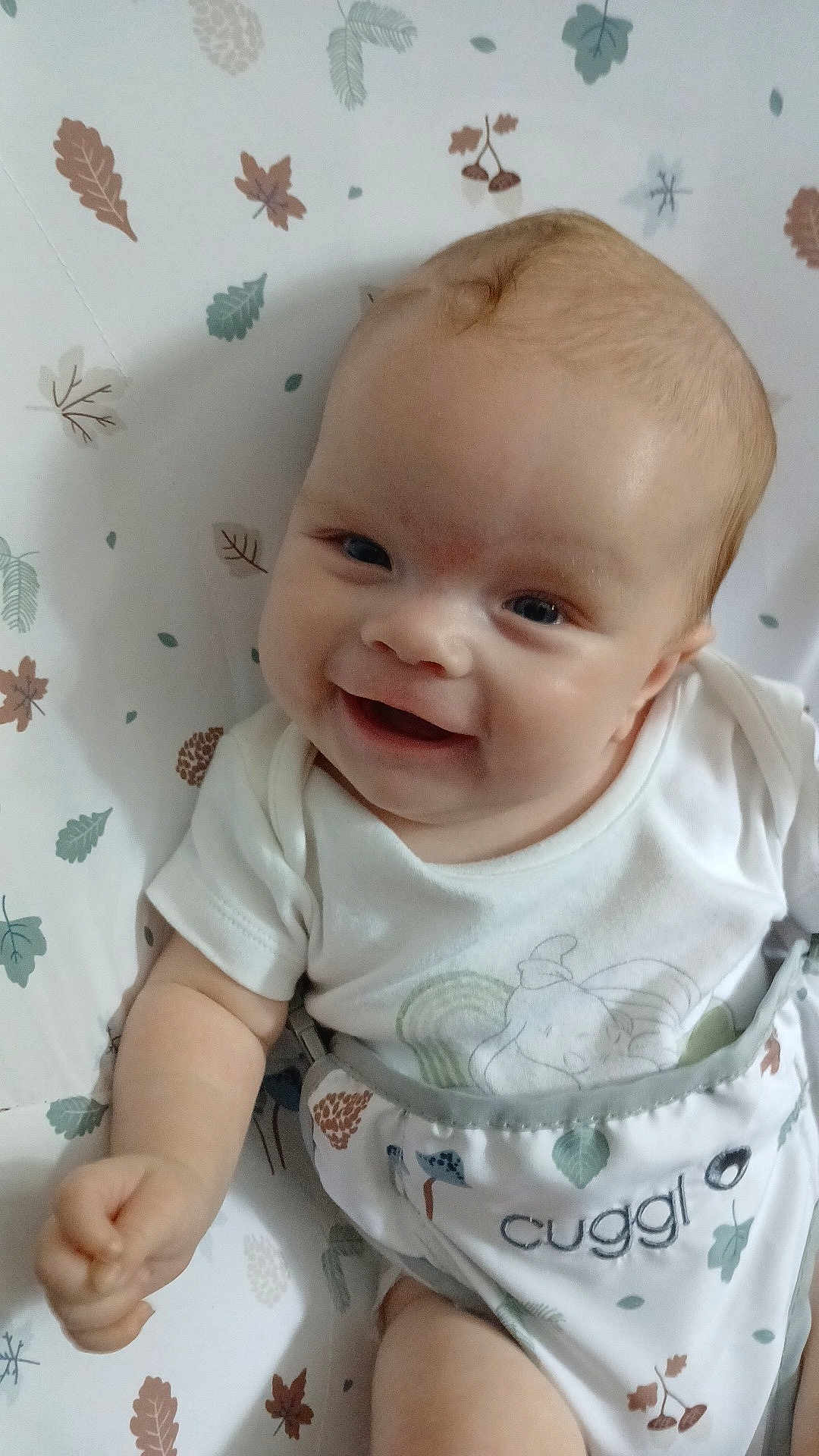 Abbie Jo joined the competition — help win amazing prizes! baby, smiling, infant, white_clothing, cushion, leaf_pattern, happy, cute, face, child, cheerful, indoors, light_skin, sitting, small_hand, onesie, baby_boy, playful, comfort, portrait