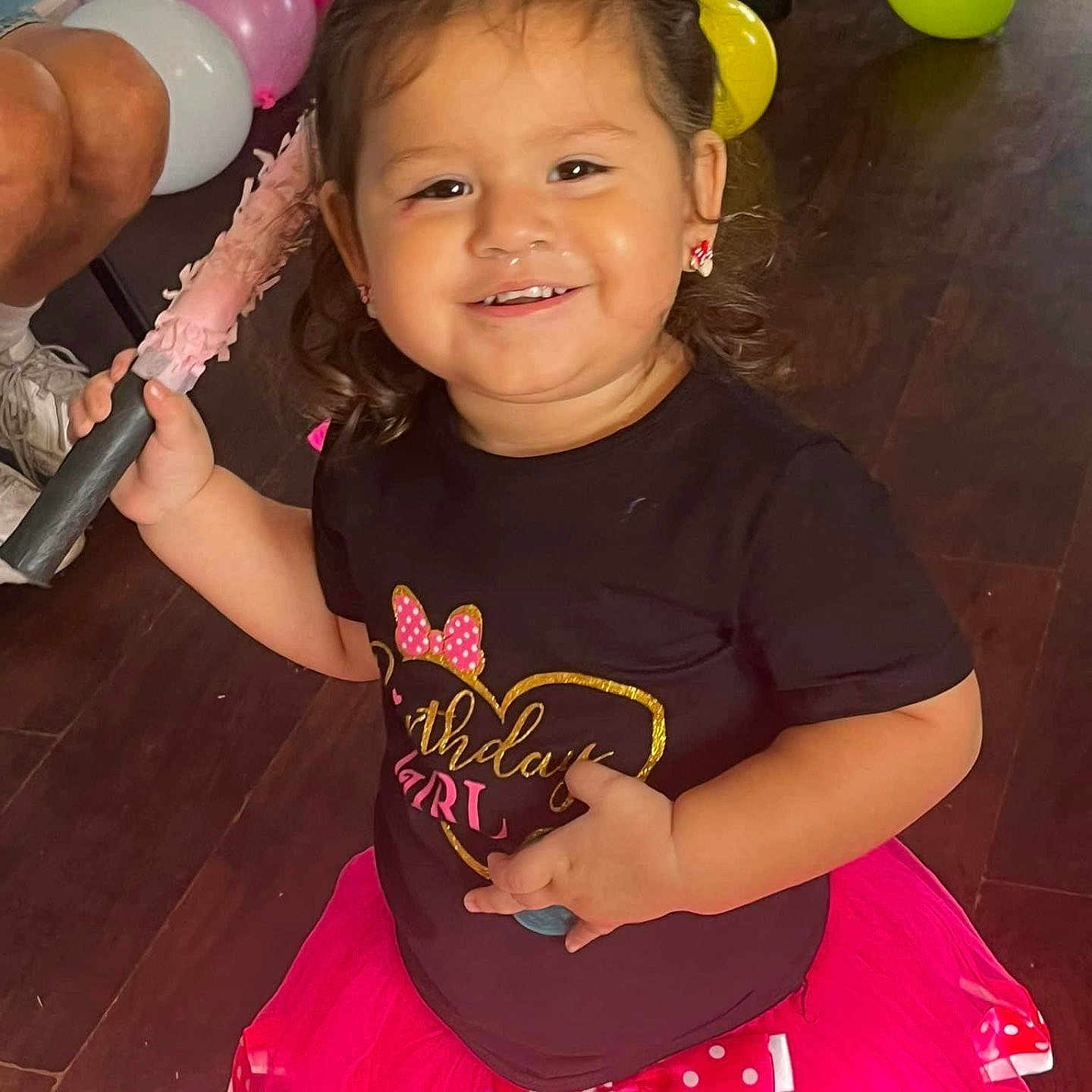 Martha is registered to the contest to win money with this photo: balloon, child, clothing, face, female, girl, happy, head, person, photography, pingpong, pingpongpaddle, portrait, racket, skirt, sleeve, smile, sport, tennis, tennisracket