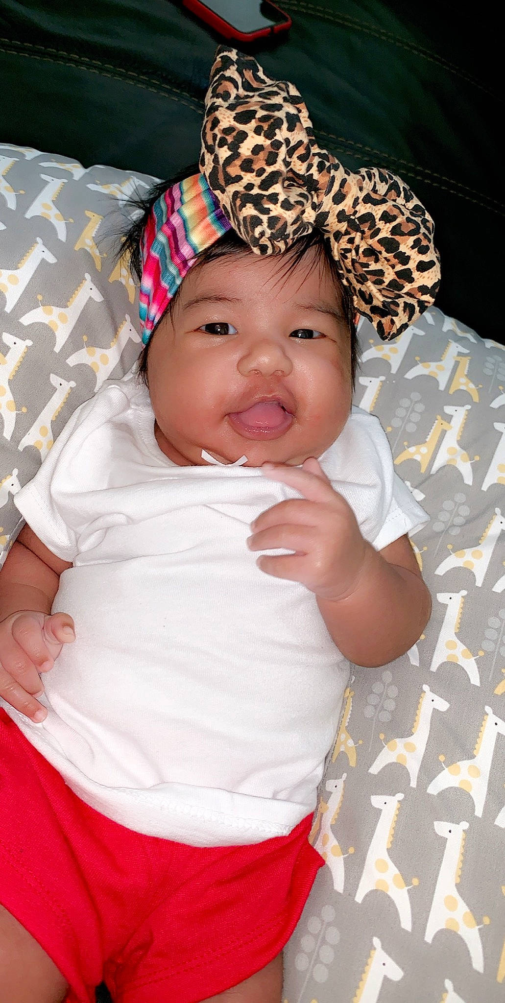 Julissa is registered to the contest to win money with this photo: baby, baby_toddler_clothing, bonnet, cheek, child, fashion_accessory, hair_accessory, head, headgear, headwear, person, skin, smile, toddler