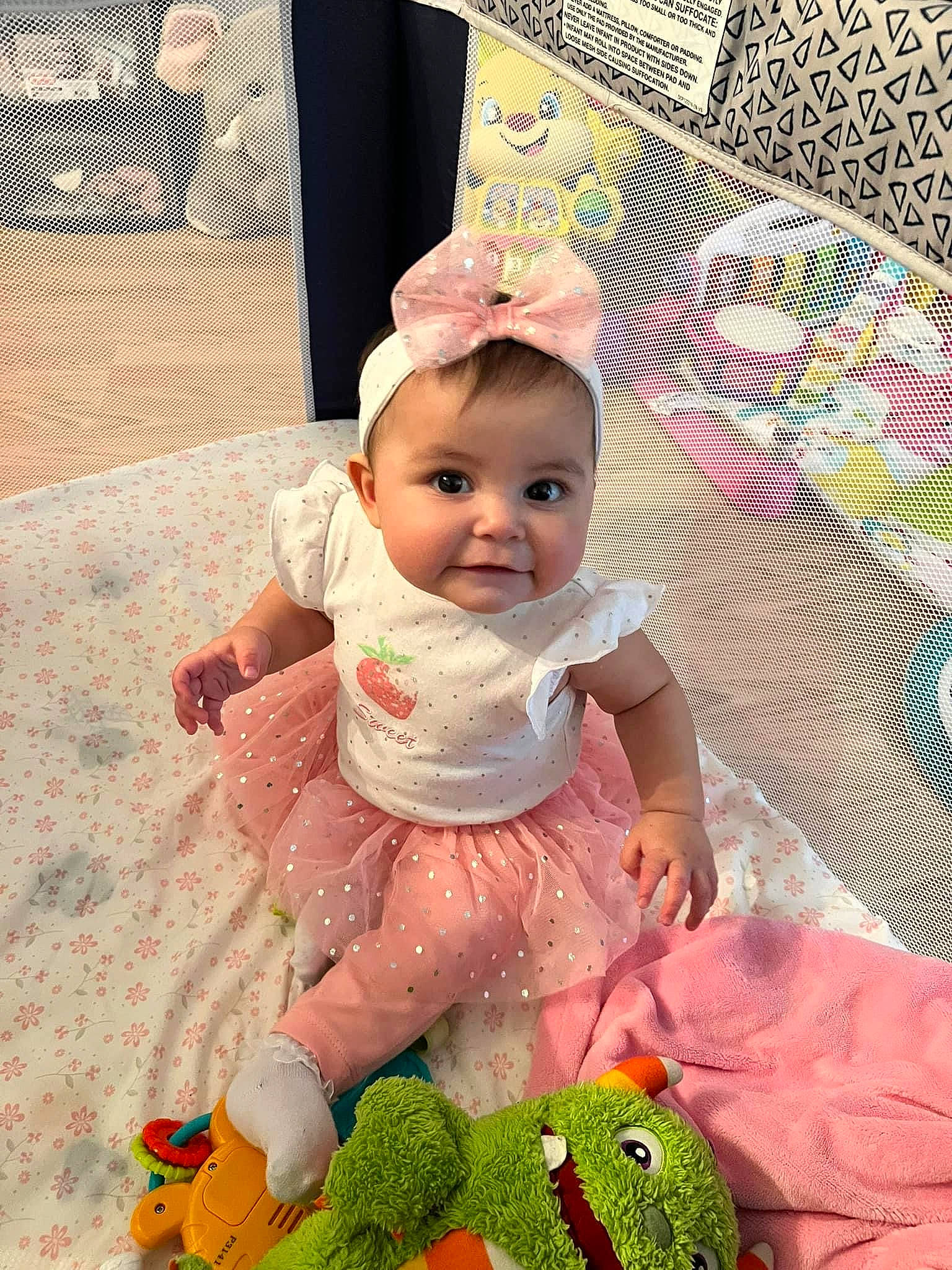 Abigail joined the competition — help win amazing prizes! baby, baby_products, baby_toddler_clothing, cheek, child, fashion_accessory, fun, green, happy, head, linens, magenta, pattern, person, pink, product, room, sitting, skin, textile