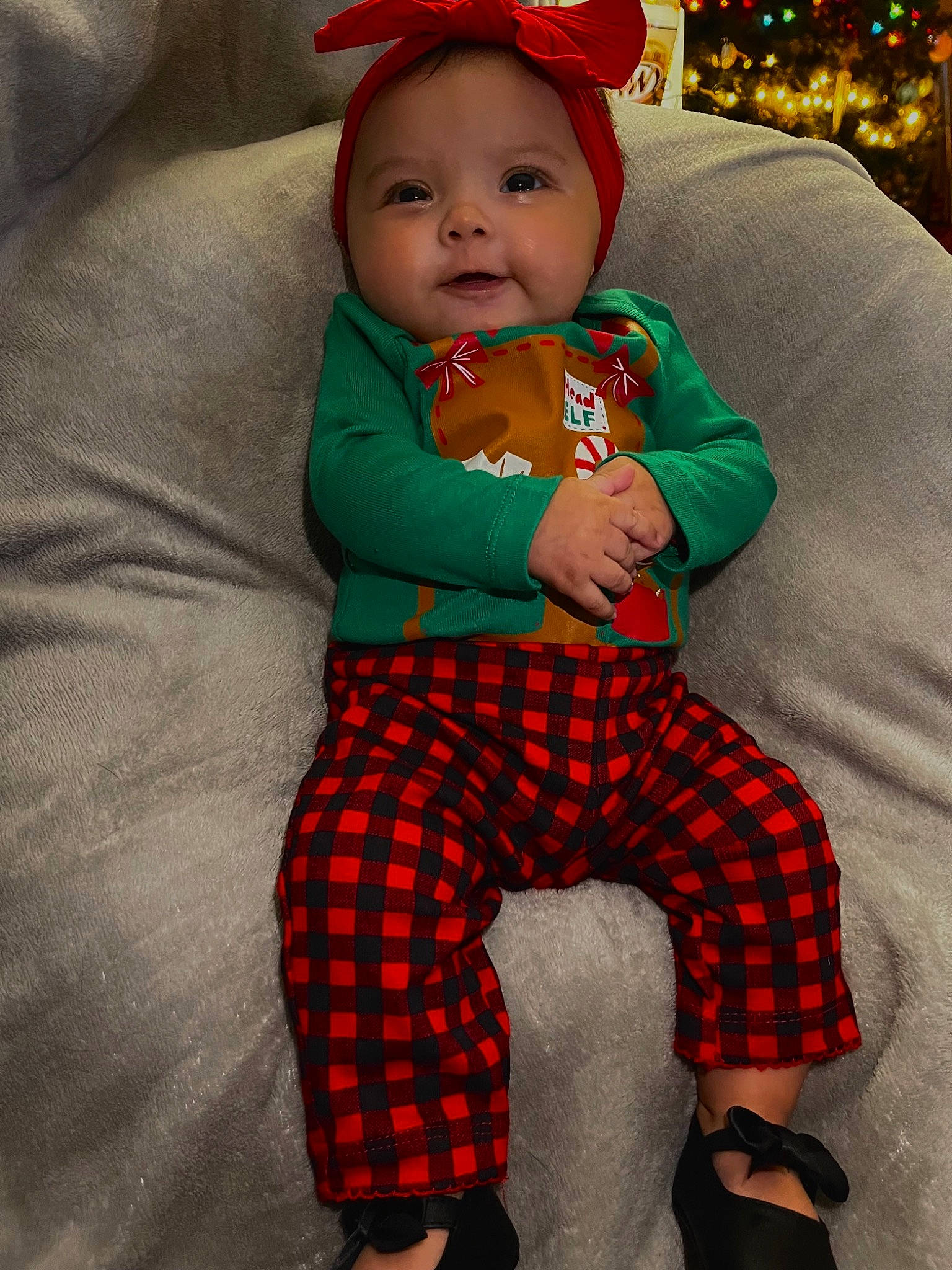 Lylah joined the competition — help win amazing prizes! baby, baby_toddler_clothing, child, comfort, costume_hat, event, eye, face, fun, happy, head, lap, pattern, person, plaid, sitting, sleeve, smile, standing, tartan