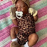 Niyani is registered to the contest to win money with this photo: baby, sleeping, pacifier, mittens, headband, bow, leopard_print, onesie, blanket, crochet, pink, green, white, slippers, footwear, infant, cute, cozy, resting, child