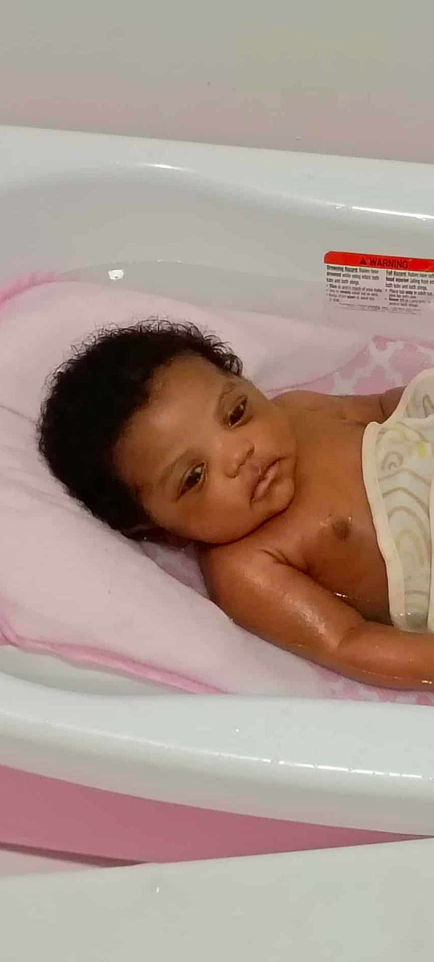 Phynex joined the competition — help win amazing prizes! baby, bathtub, water, towel, infant, curly_hair, skin, child, bath_time, pink, white, indoors, young, cute, resting, face, portrait, newborn, relaxed, clean