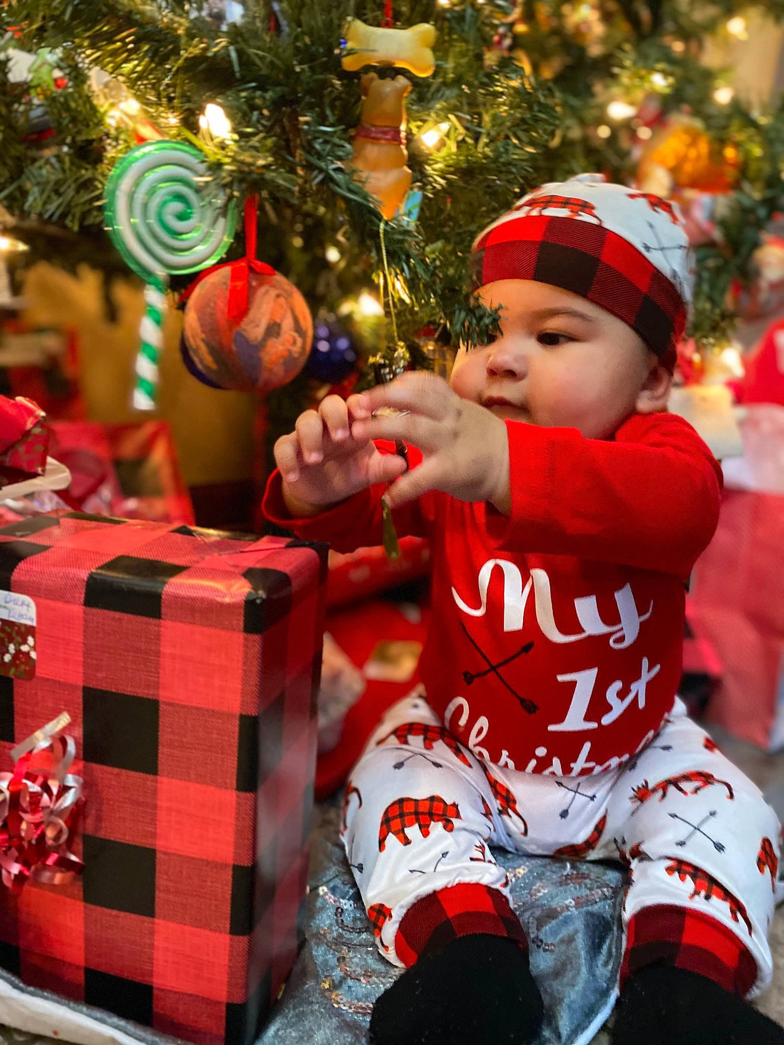 Kylo is registered to the contest to win money with this photo: baby_toddler_clothing, child, christmas, christmas_decoration, christmas_eve, christmas_ornament, christmas_tree, event, fictional_character, fun, happy, headwear, holiday, holiday_ornament, light, ornament, person, sleeve, snapshot, toddler