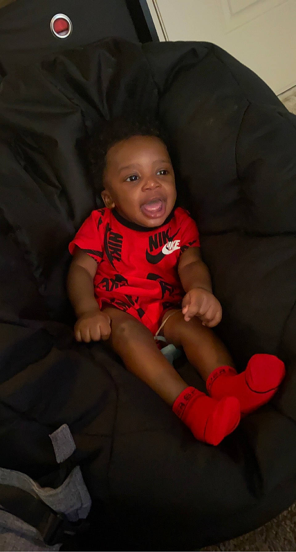 Casey is registered to the contest to win money with this photo: baby, baby_toddler_clothing, cheek, comfort, eye, face, finger, flash_photography, hand, head, human_body, knee, lap, leg, lip, mouth, neck, person, skin, sleeve