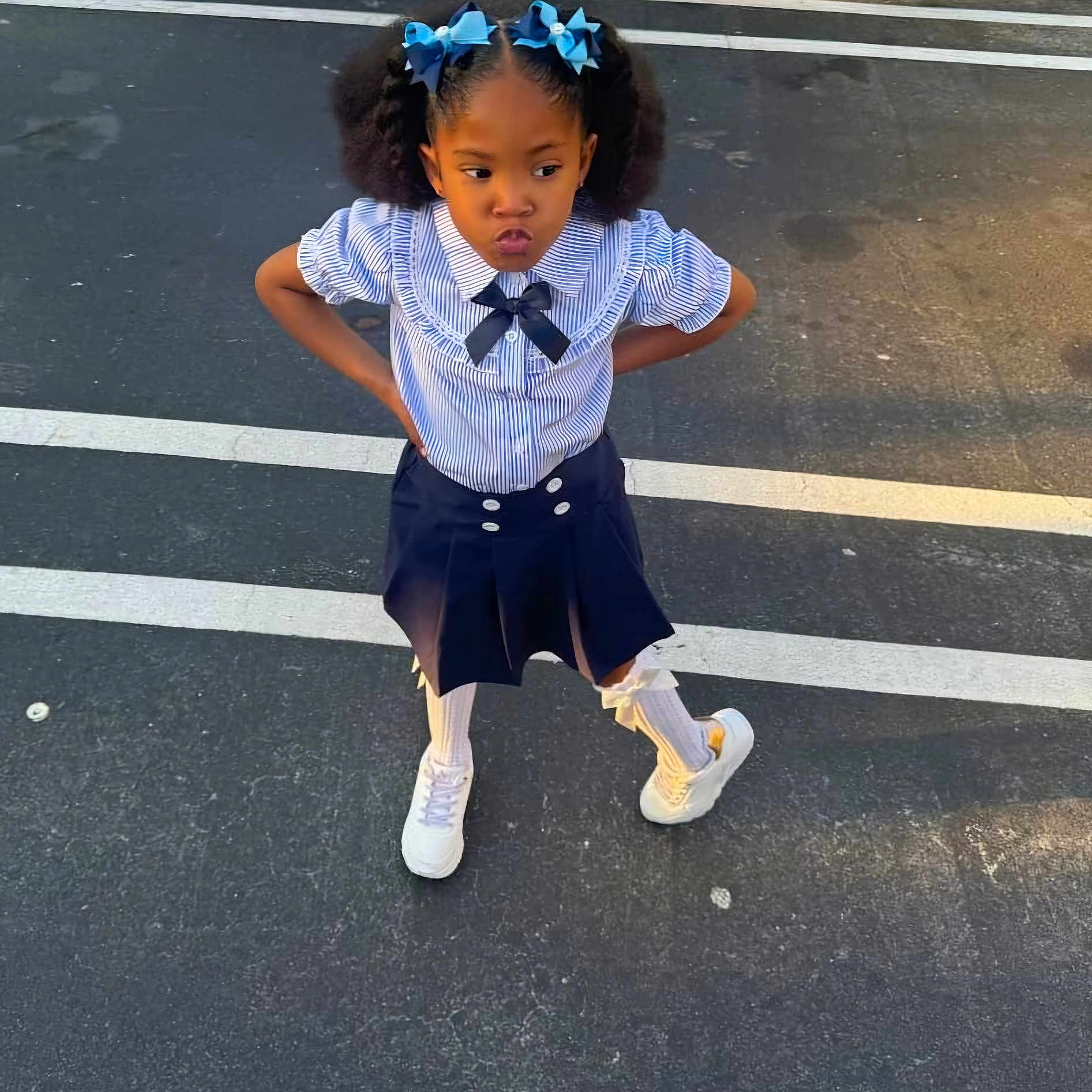 Z'Eeysha is registered to the contest to win money with this photo: blackhair, child, clothing, curlyhair, face, female, girl, hair, head, pants, pedestrian, person, sitting, sleeve, standing, student