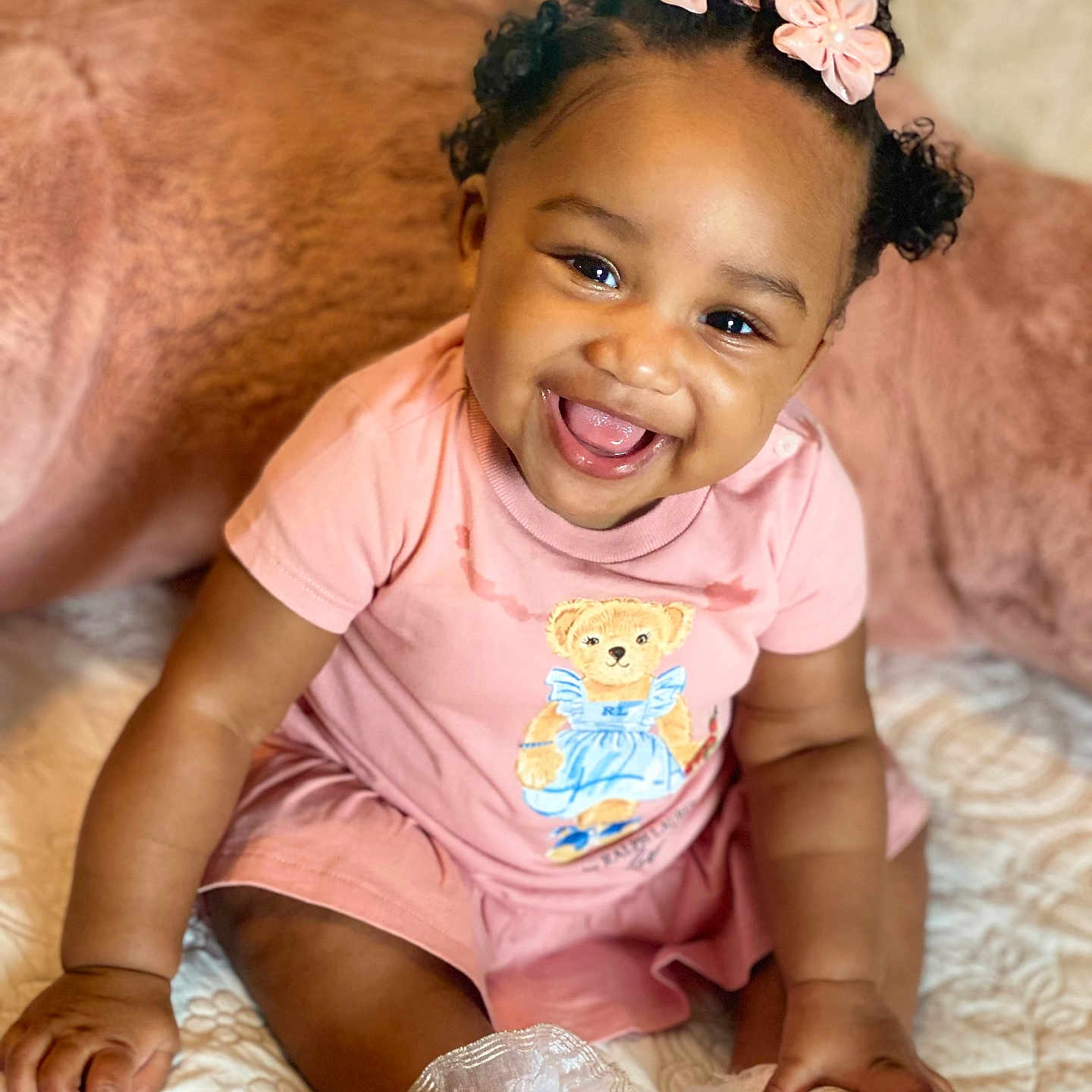 Ruby joined the competition — help win amazing prizes! accessories, baby, babylaughing, clothing, couch, cushion, dress, face, furniture, happy, head, homedecor, jewelry, laughing, necklace, person, photography, portrait, sitting, smile