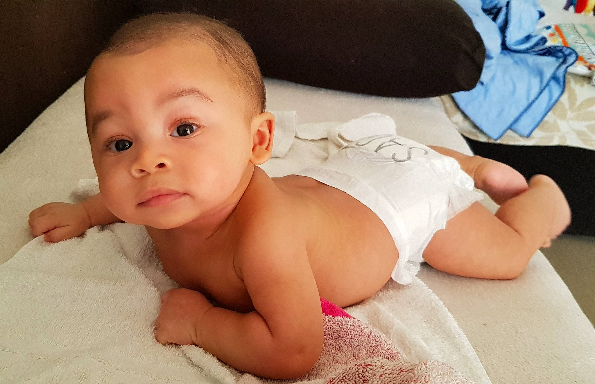 Pharell participe au concours pour gagner de l'argent avec cette photo : arm, baby, beauty, cheek, chest, child, diaper, eye, face, hand, head, leg, lip, mouth, muscle, neck, person, skin, stomach, toddler