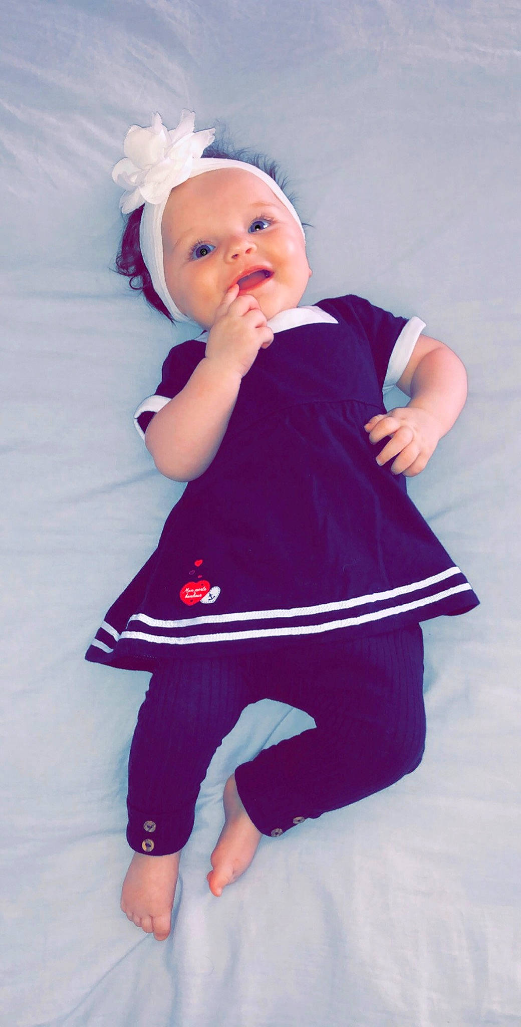 Chelby a rejoint le concours — aidez-le/la à gagner de superbes lots ! arm, baby, baby_toddler_clothing, blue, child, child_model, clothing, headgear, leggings, magenta, pattern, person, pink, product, purple, sleeve, standing, textile, toddler, trousers